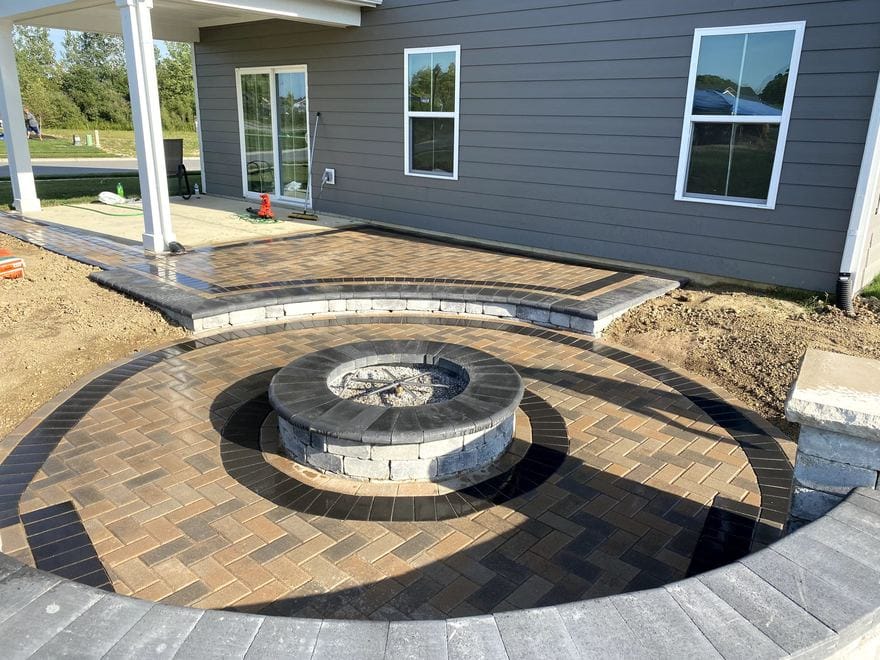 Paver patio with a stone fire pit
